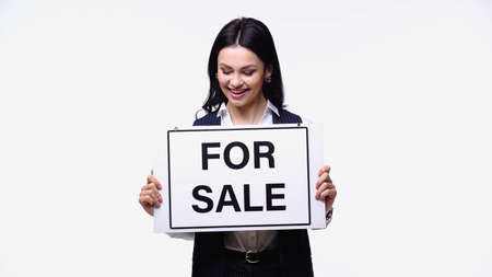 Broker looking at lettering for sale on signboard isolated on whiteの写真素材