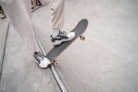 partial view of man in sneakers skating on skate rampの写真素材