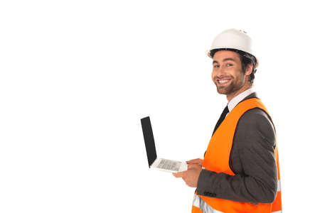 Engineer in safety vest holding laptop isolated on whiteの写真素材