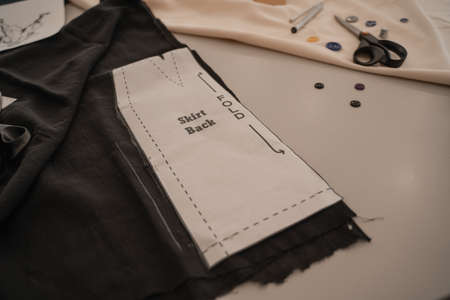 Sewing pattern on cloth in designer studioの写真素材