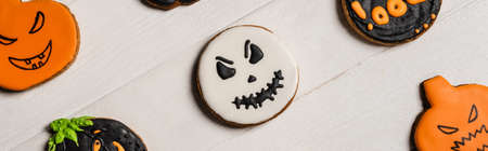 top view of sweet and spooky halloween cookies on white surface, bannerの写真素材