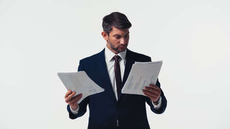 Manager in formal wear looking at papers isolated on whiteの写真素材