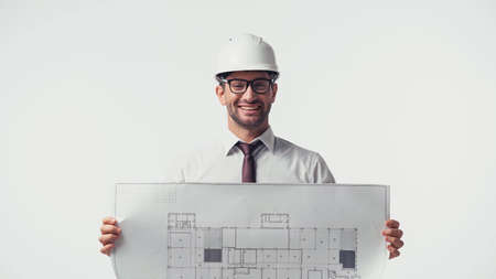 Cheerful engineer showing blueprint isolated on whiteの写真素材