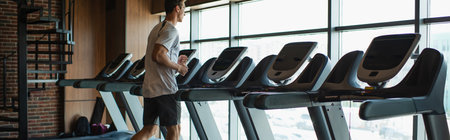 man in sportswear exercising on treadmill in gym, banner