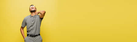 joyful african american man in sunglasses and grey tennis shirt laughing isolated on yellow, banner