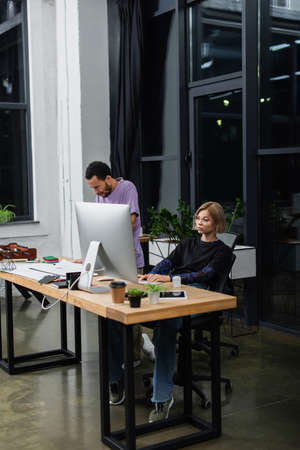 young multiethnic colleagues working on start up in modern officeの写真素材