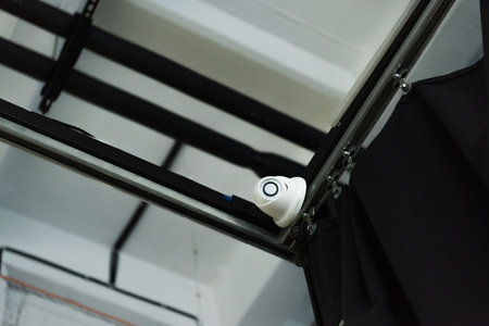 low angle view of cctv camera om metal constructionの写真素材