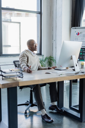 young african american businessman in glasses working in officeの写真素材