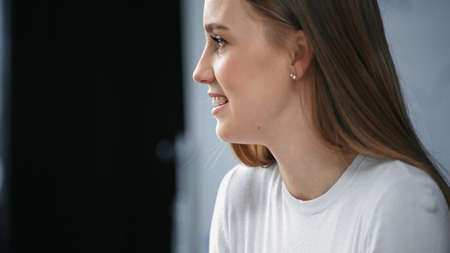 profile of young businesswoman smiling in officeの写真素材