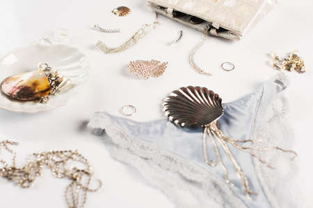 Close up view of panties, accessories and bag on white backgroundの写真素材