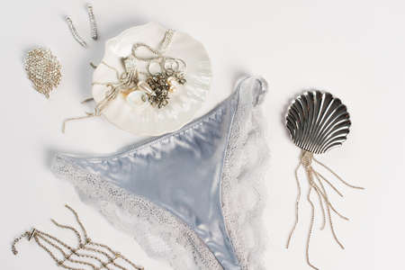 Top view of panties near accessories on white backgroundの写真素材