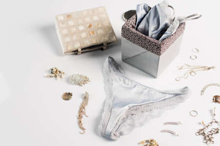 Lingerie near box and accessories on white backgroundの写真素材