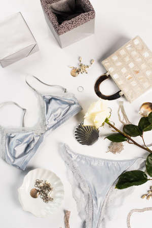 Top view of gift box, bag and lingerie on white backgroundの写真素材