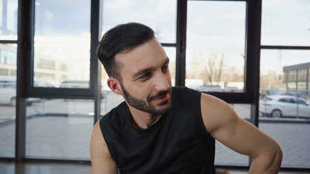 Athletic sportsman looking away in sports centerの写真素材