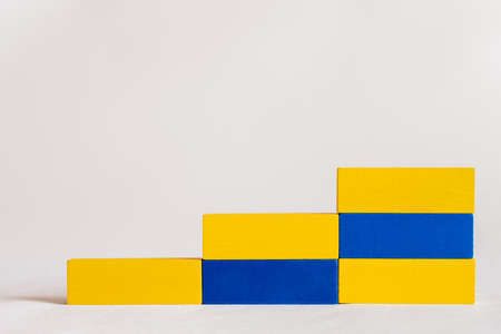stairs made of rectangular blue and yellow blocks on white background, ukrainian conceptの写真素材