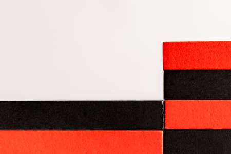 close up view of rectangular red and black blocks isolated on whiteの写真素材