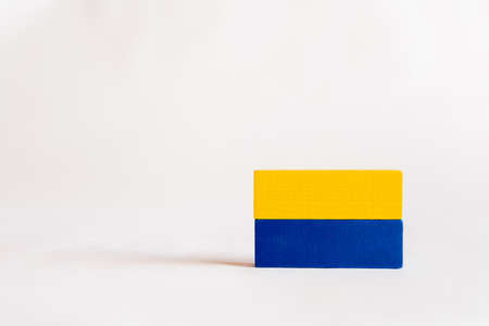 blue and yellow rectangular blocks on white background with copy space, ukrainian conceptの写真素材