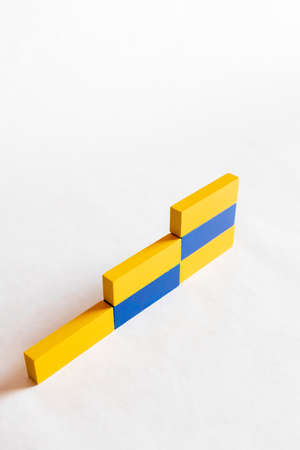 top view of stairs made of blue and yellow blocks on white background, ukrainian conceptの写真素材