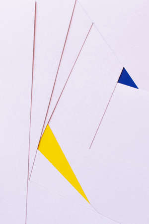 background with violet paper sheets near blue and yellow triangles, ukrainian concept