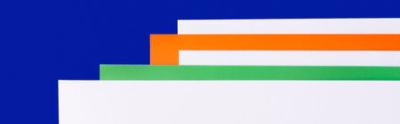 multicolored paper sheets on blue background, banner