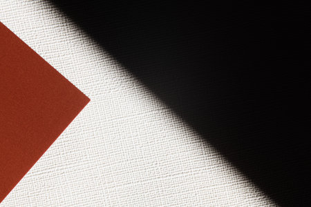 brown and white textured background with black shadowの写真素材