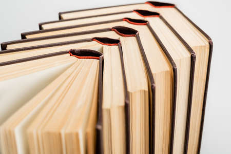 close up view of paper books collection isolated on gray