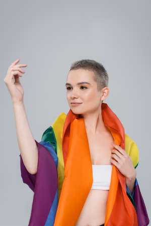 young woman with lgbt flag looking away isolated on greyの写真素材