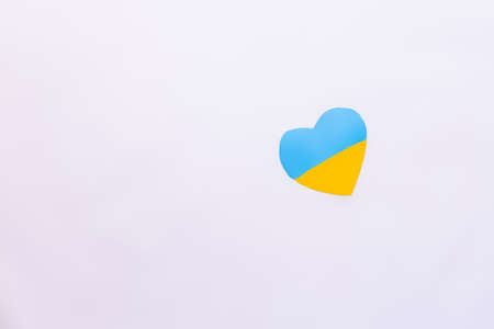 Top view of ukrainian flag in heart shape on white backgroundの写真素材