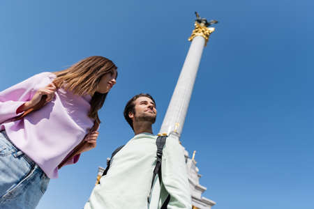 KYIV, UKRAINE - SEPTEMBER 1, 2021: Low angle view of travelers with backpacks looking away on Independence Squareのeditorial素材