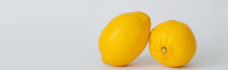 Close up view of organic lemons on white background, banner