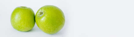green and ripe apples on white, bannerの写真素材