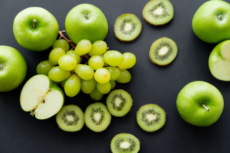 top view of green fresh fruits on blackの写真素材