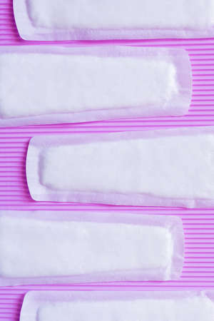 top view of soft breathable panty liners on textured violet backgroundの写真素材
