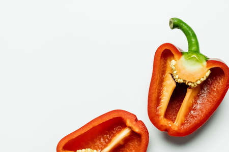 Top view of cut ripe paprika on white background with copy spaceの写真素材