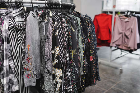Blouses on hangers in second handの写真素材