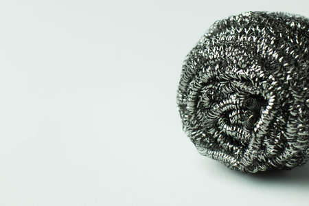 close up view of metal wire scourer on grey background with copy spaceの写真素材