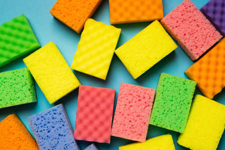 plenty of multicolored washcloths on blue background, top viewの写真素材