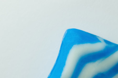 close up view of blue and white soap bar isolated on grey, top viewの写真素材