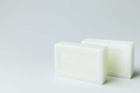white toilet soap bars on grey backgroundの写真素材