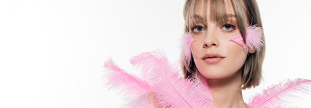 young woman with decorative beads on neck near pink feathers isolated on white, banner