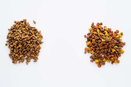 top view of different dry food for pets isolated on whiteの写真素材