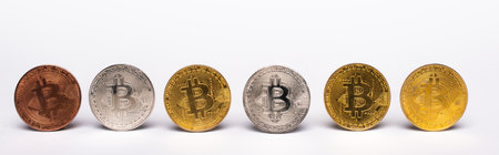 KYIV, UKRAINE - APRIL 26, 2022: Row of crypto coins on white background, bannerのeditorial素材