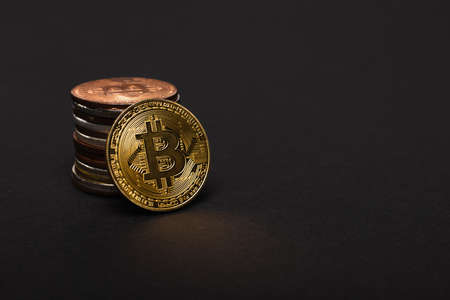KYIV, UKRAINE - APRIL 26, 2022: Close up view of cryptocurrency on black background