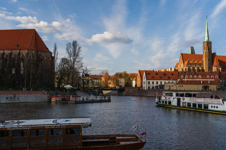 WROCLAW, POLAND - APRIL 18, 2022: Boats on river near Ostrow Tumski at daytime