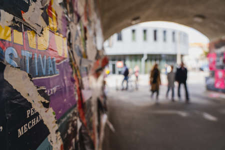 WROCLAW, POLAND - APRIL 18, 2022: Advertising on wall in tunnel on urban streetのeditorial素材