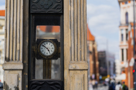 Clock on blurred urban street in Wroclawの写真素材
