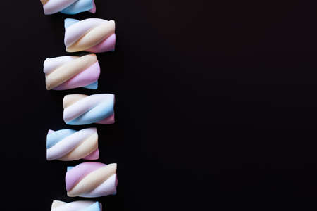 Top view of delicious marshmallows isolated on blackの写真素材