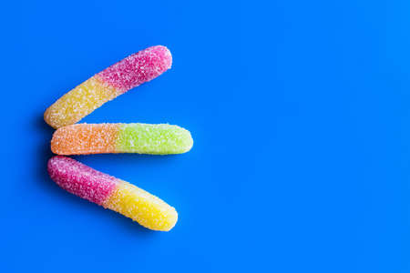 Top view of jelly sweets on blue backgroundの写真素材