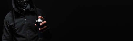 Cropped view of african american hooligan holding spray paint isolated on black, bannerの写真素材