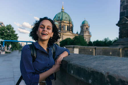 BERLIN, GERMANY - amazed young woman near blurred berlin cathedralの写真素材